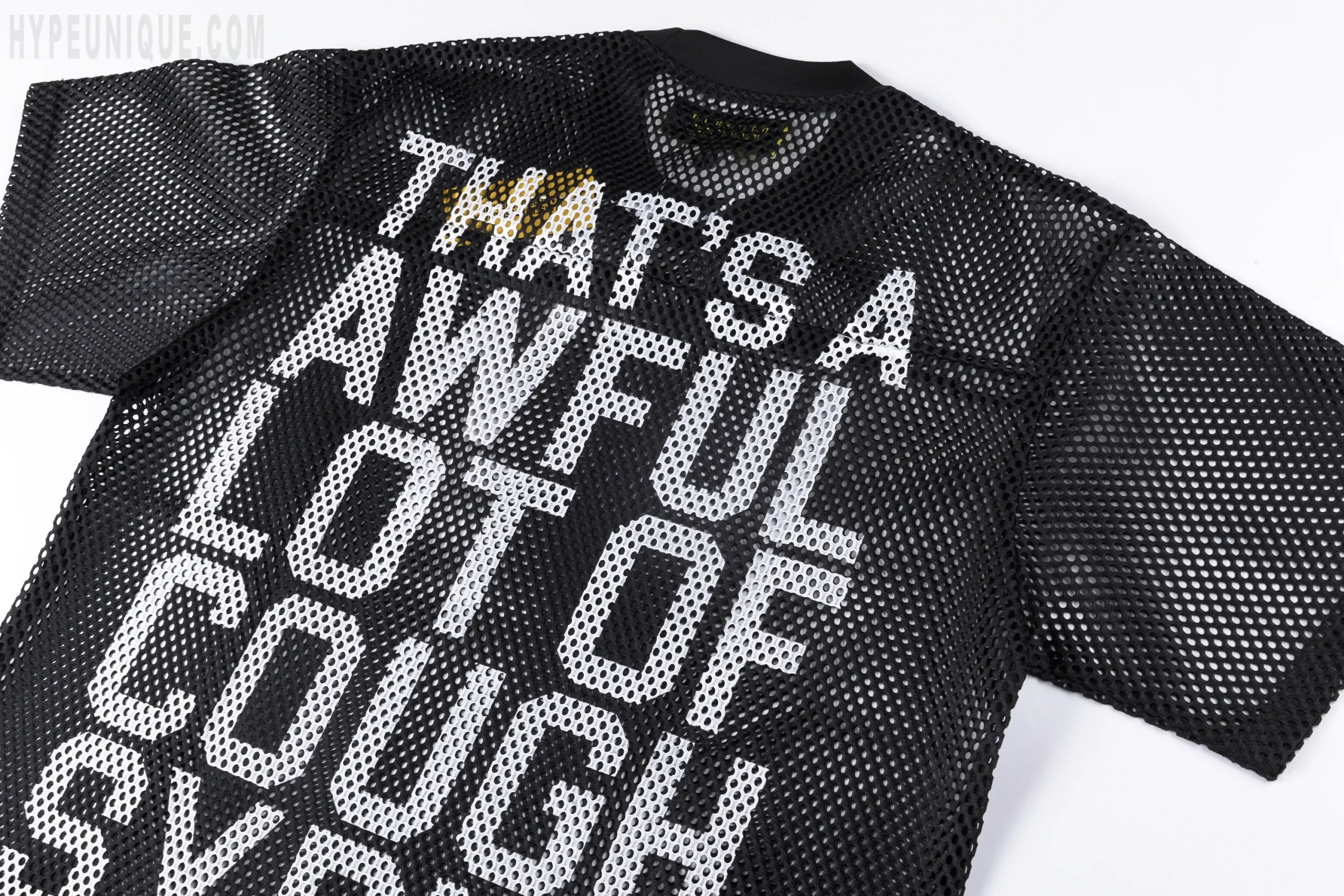 That's A Awful Lot of Cough Syrup Letter Mesh T-shirt, back view. Showing the black offset print details.