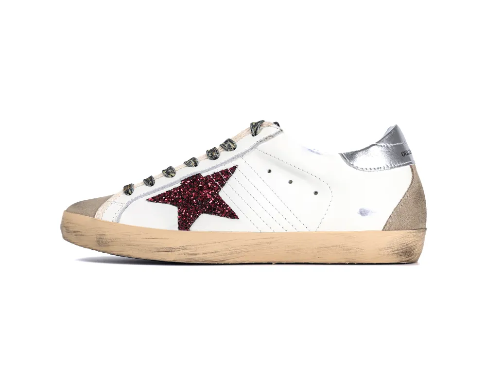 Lateral side view of Golden Goose sneaker with burgundy glitter star