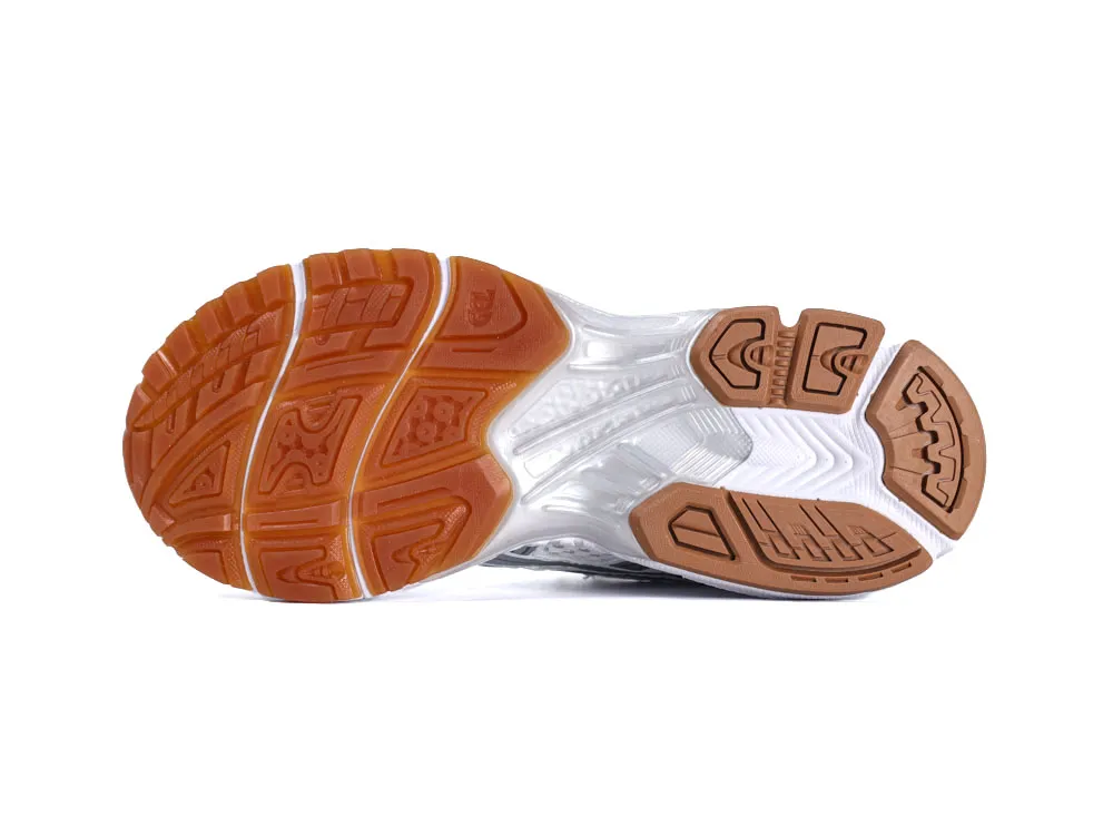 Brown rubber outsole with textured grip pattern on a white background.