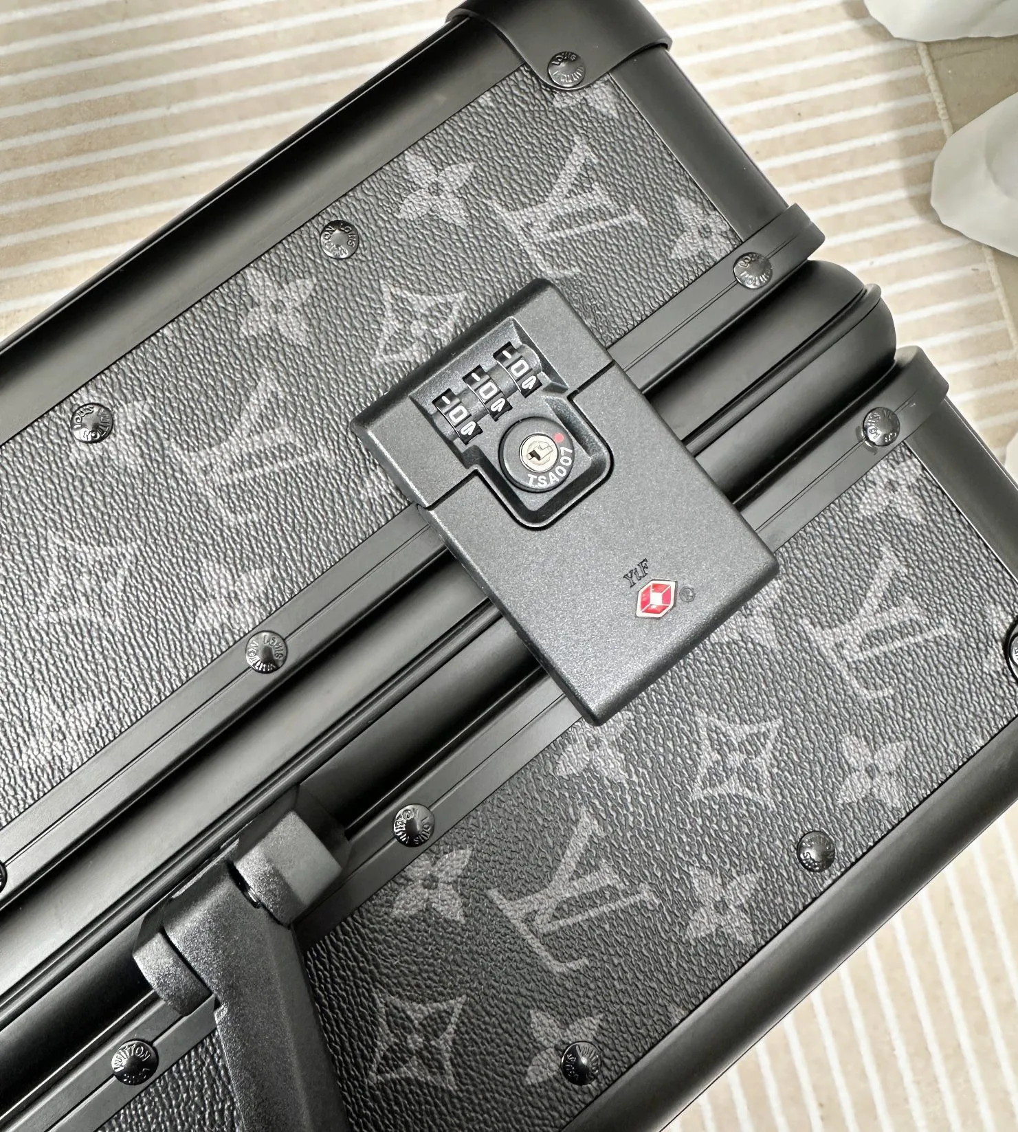 Rolling travel luggage TSA combination lock detail