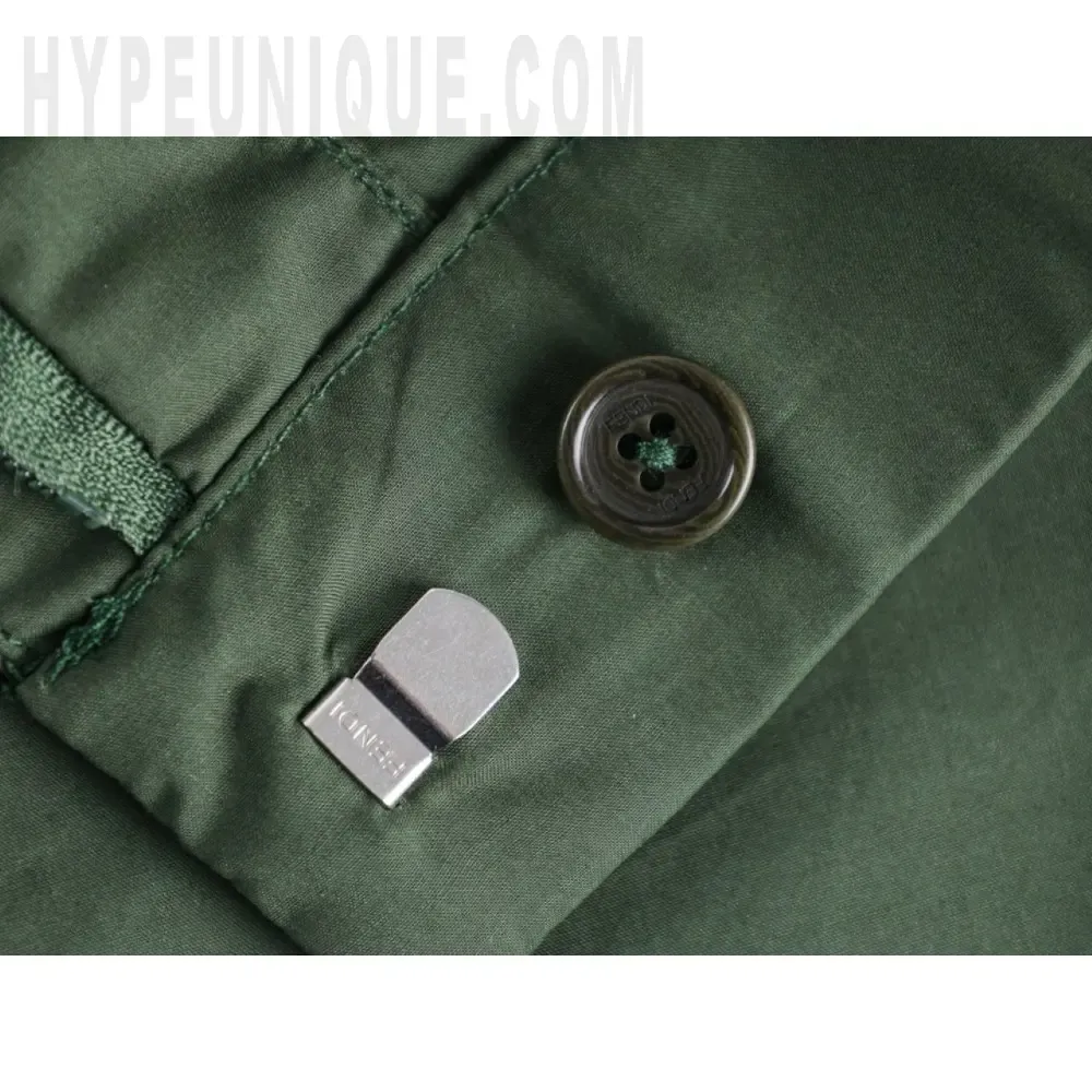 Close-up of button detail on the shorts