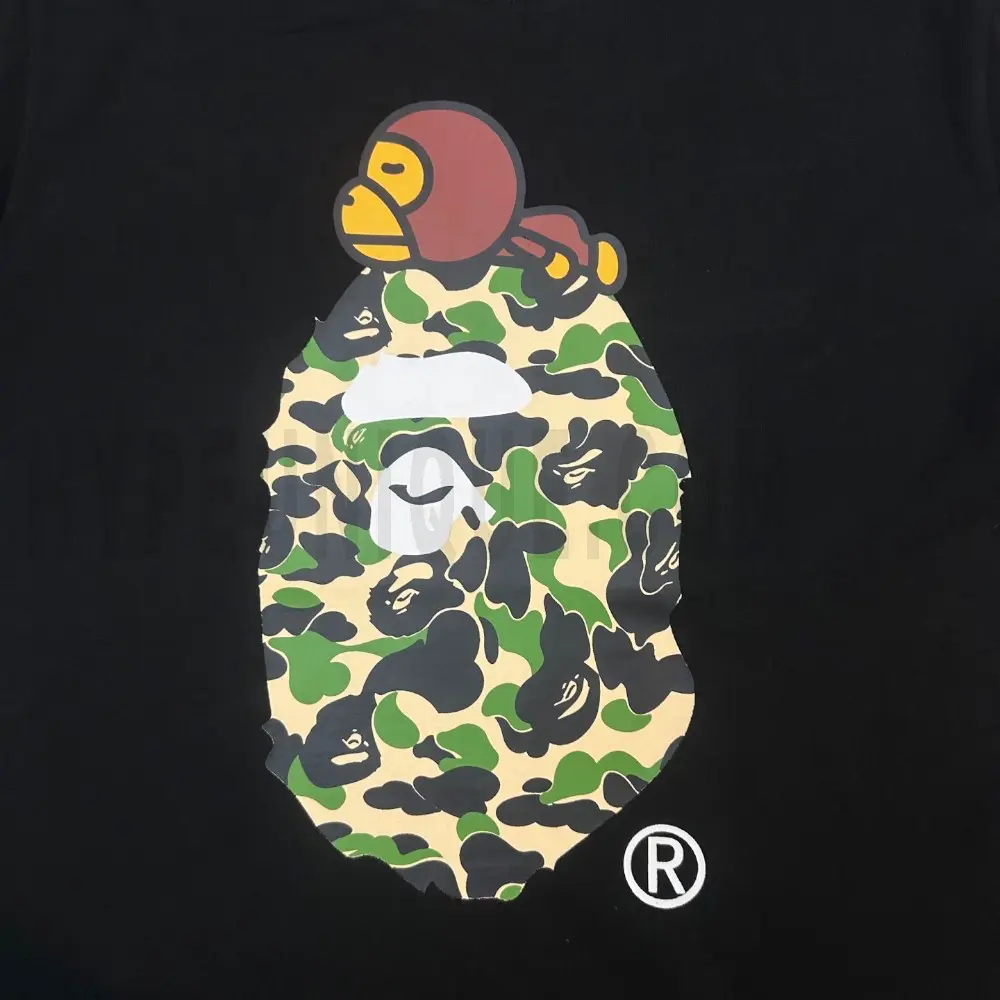 Detailed shot capturing the graphic print on the black tee's front panel.