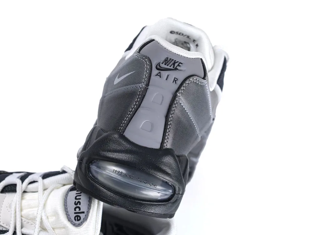 Gray and black sneaker with mesh material and visible air sole unit.