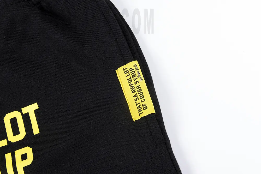 That's A Awful Lot of Cough Syrup Pistol Shorts with black hems and yellow logo