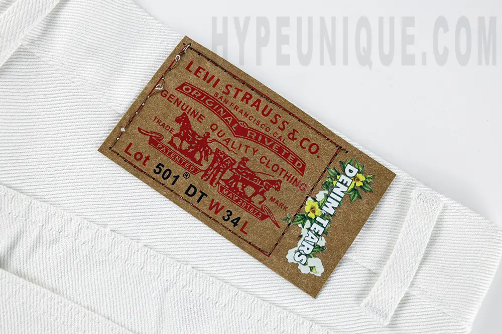 the denim tears brand tag