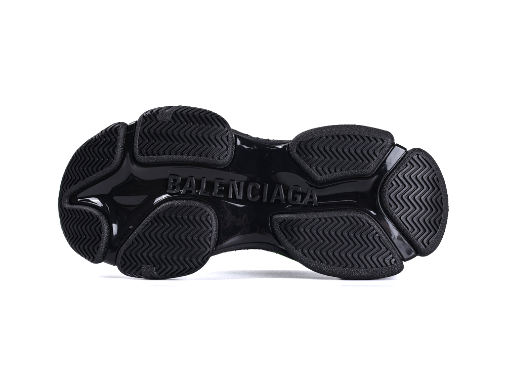 Black rubber sneaker sole with embossed logo and textured grip pattern.