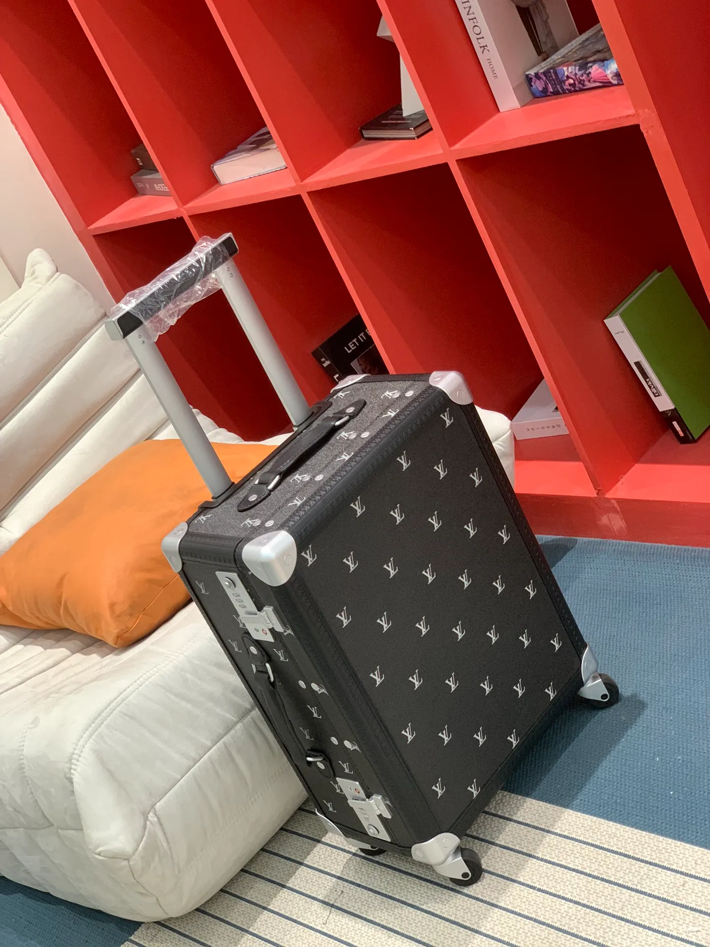 Rolling Trunk Black Monogram Carry-On Suitcase Three-Quarter View With Extended Handle