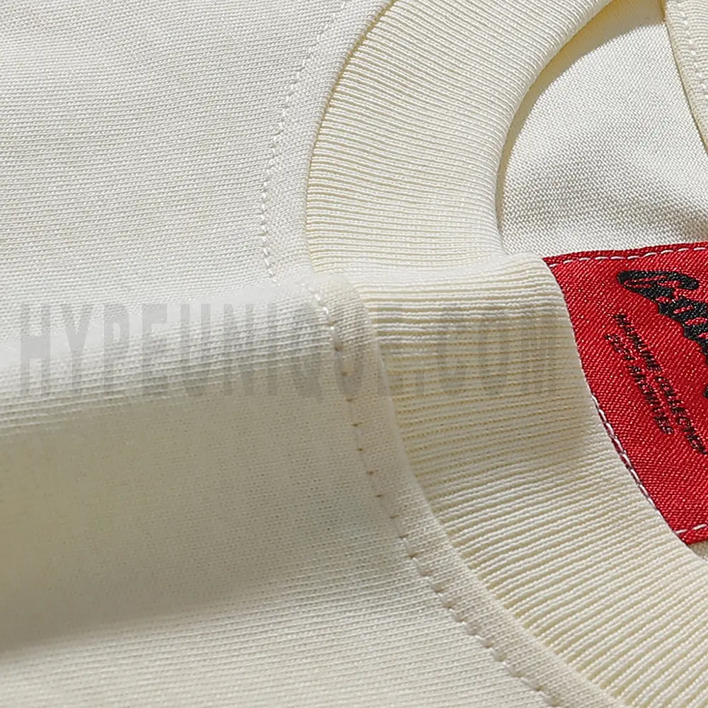 Close-up details of the premium heavyweight cotton tee, highlighting reinforced stitching and quality construction
