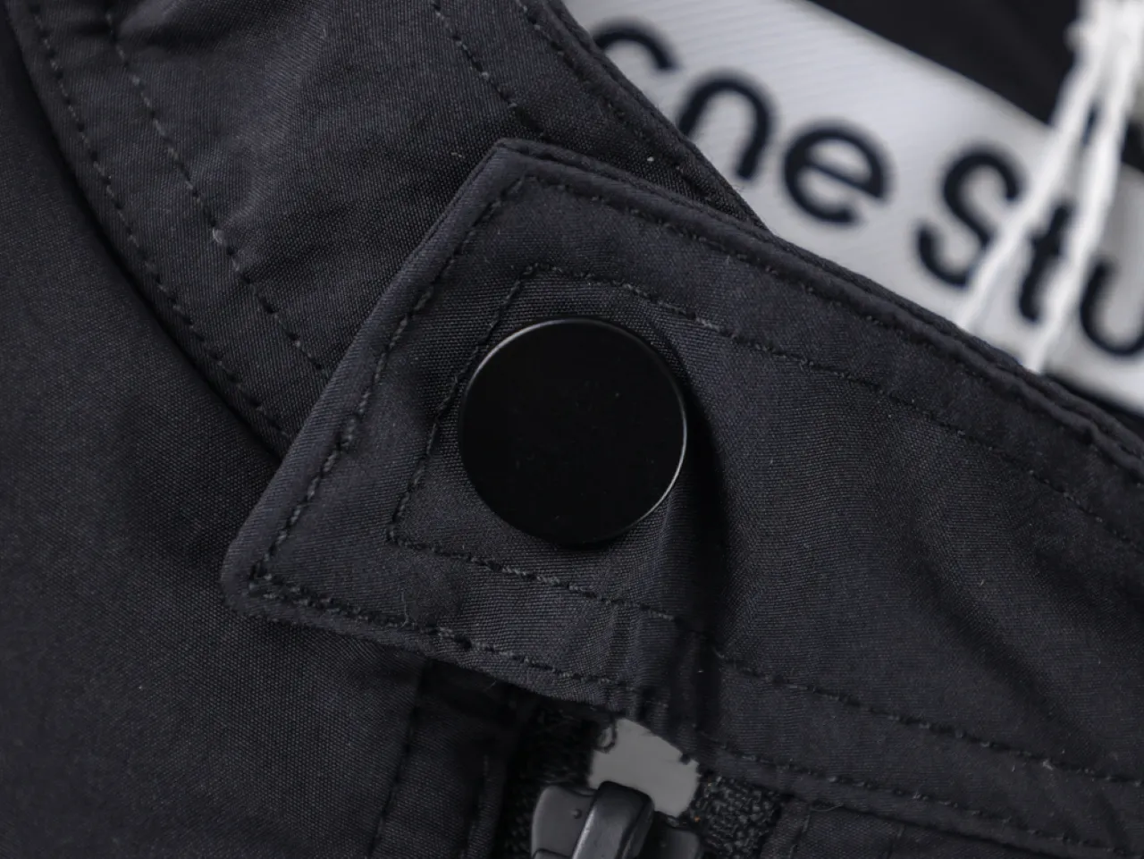 Button and zipper detail.