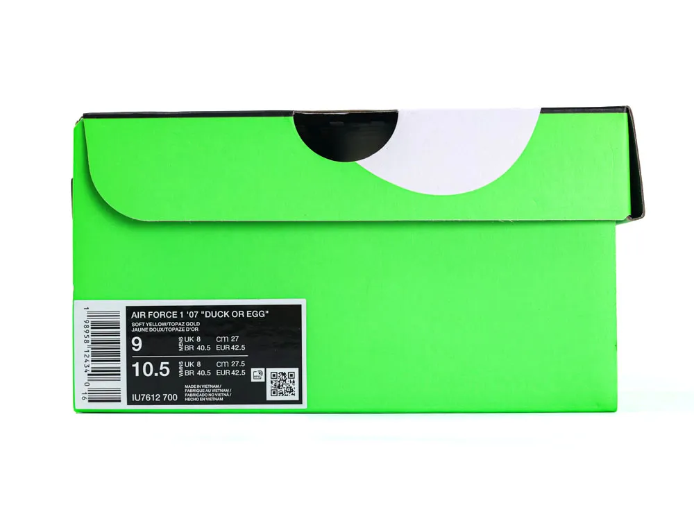 Green cardboard shoe box with a black and white label on the side.