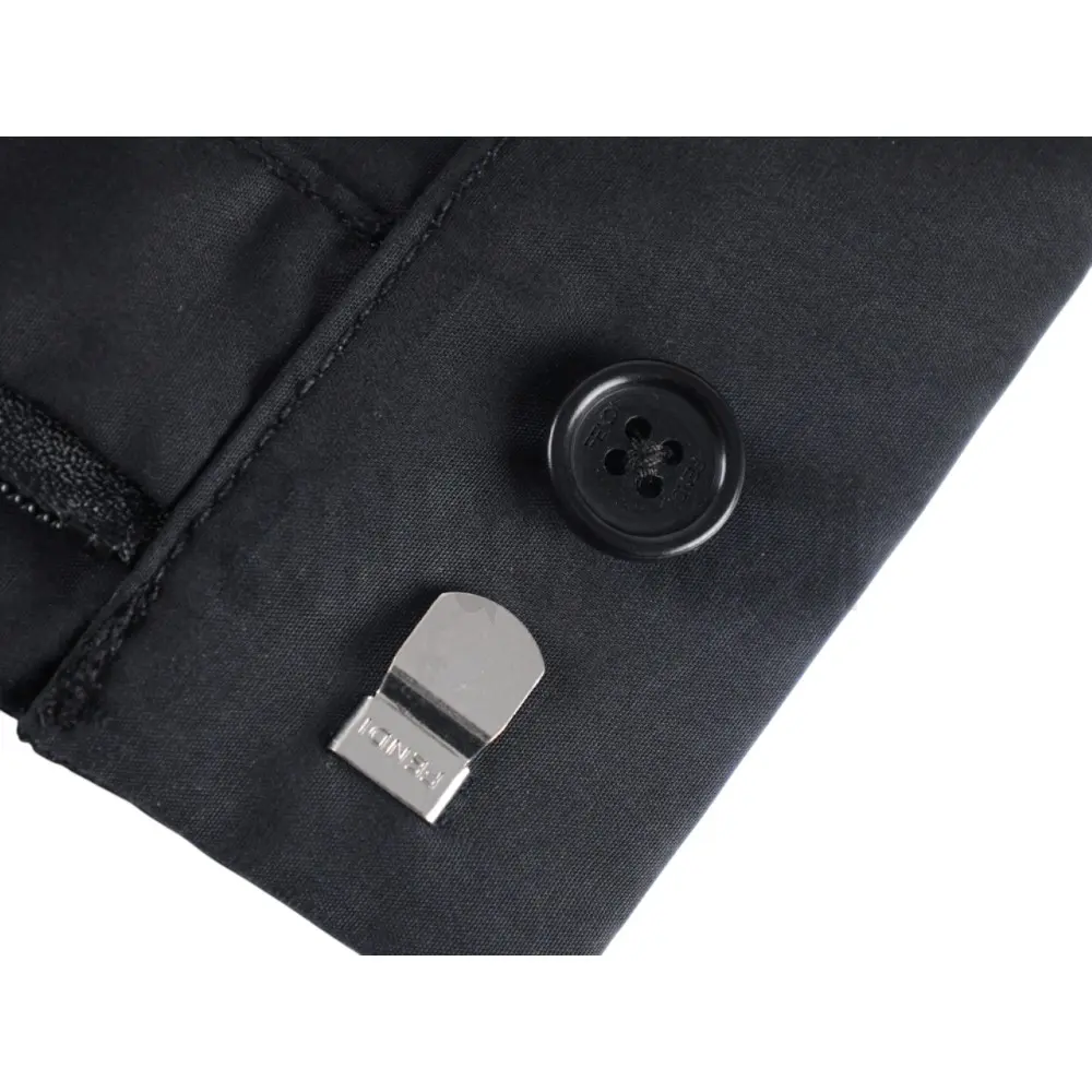 Close-up of button detail on the pants