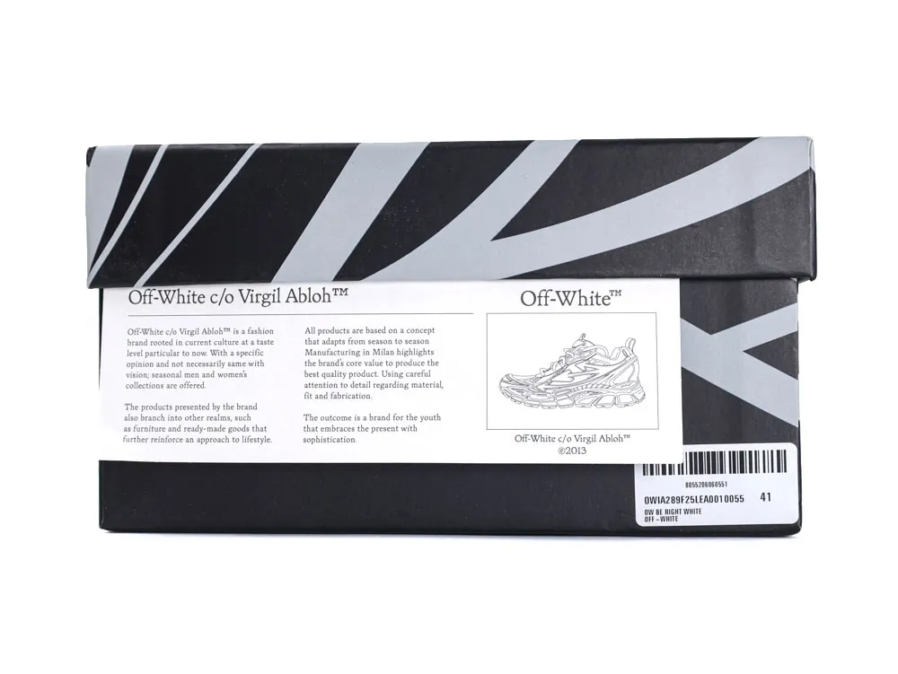 Black and gray shoe box with geometric design and printed branding details.