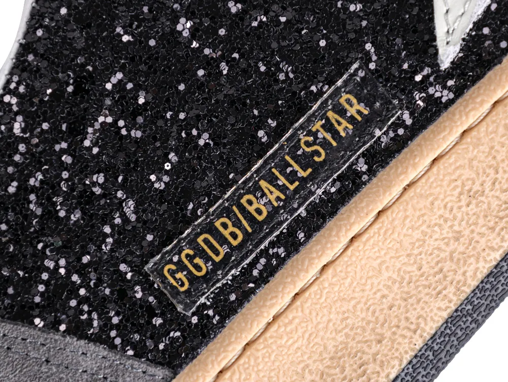 Close-up of black glitter side panel with gold GGDB/BALLSTAR logo.