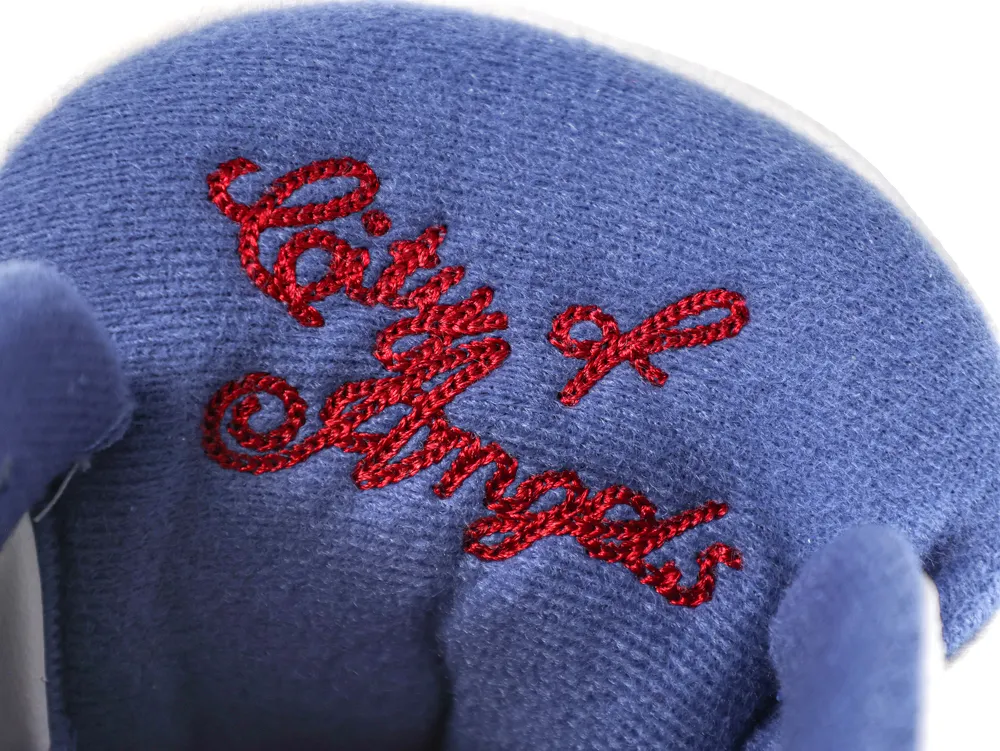 Detailed view of the interior tongue lining in blue denim with "City of Angels" embroidered in red cursive script.