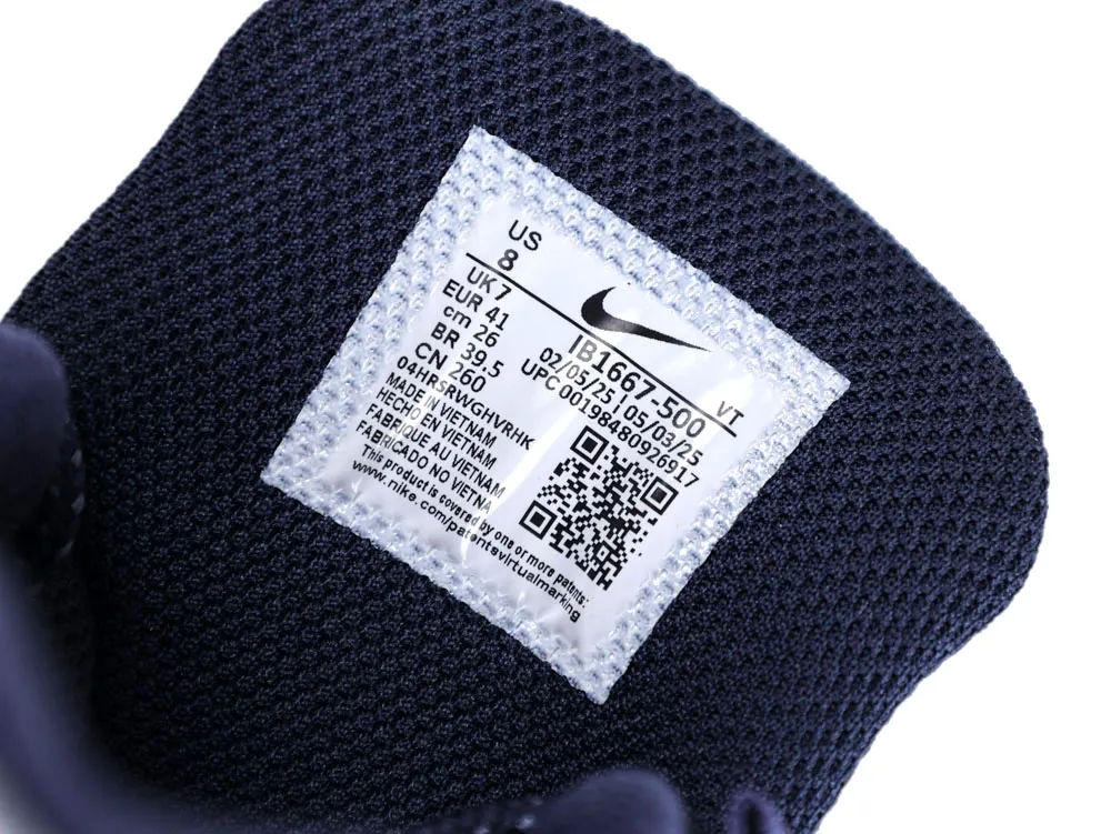 Dark mesh fabric, Nike shoe tongue label with product details and QR code.