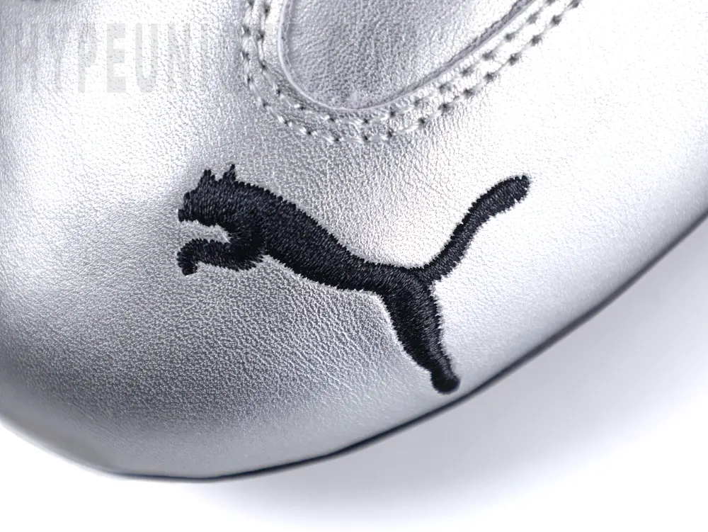 Side view of the Puma Speedcat ‘Metallic Silver’ toe area, showcasing the silver toe and the black embroidered Puma logo.