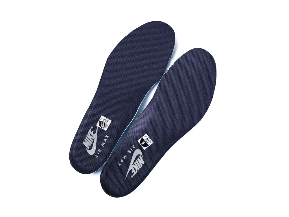 Dark blue insoles made of textured material for shoe comfort and support.