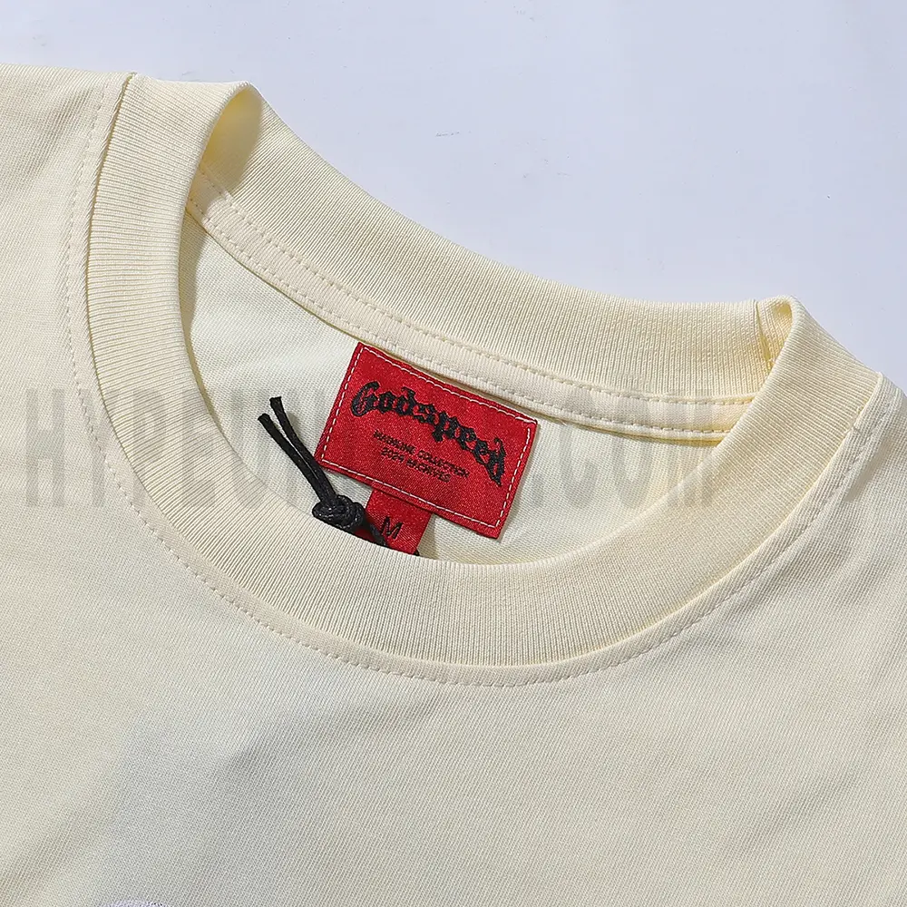Close-up of the T-shirt's neckline tag, showcasing wash care instructions and brand details in a fashion design.