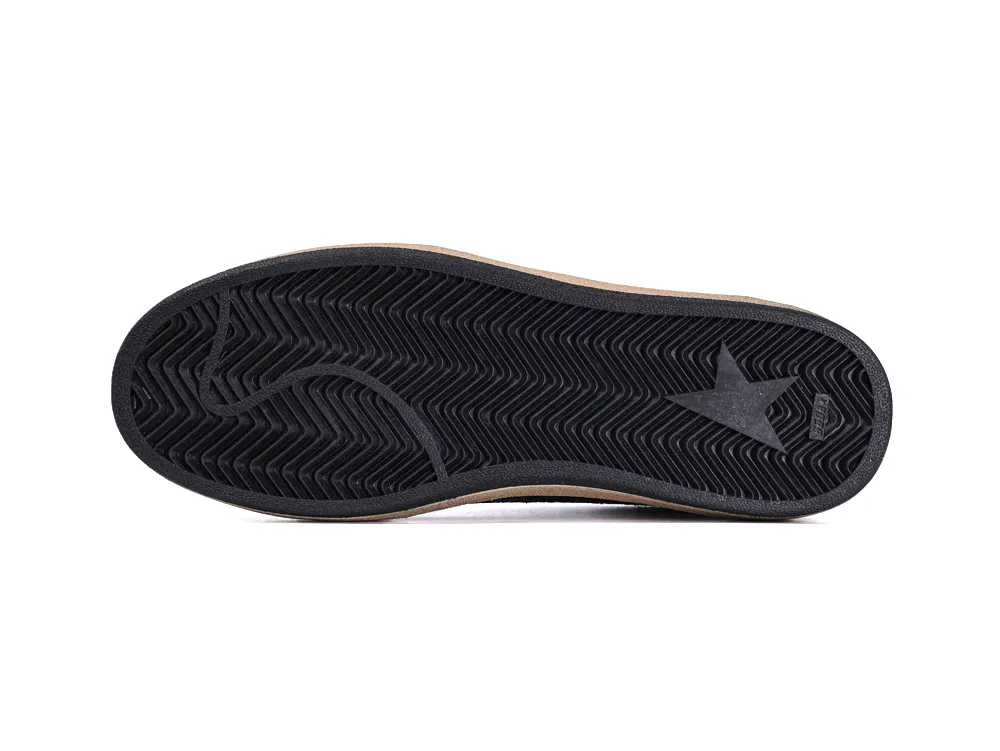 Black herringbone rubber outsole of Golden Goose Ball Star sneaker with star logo.