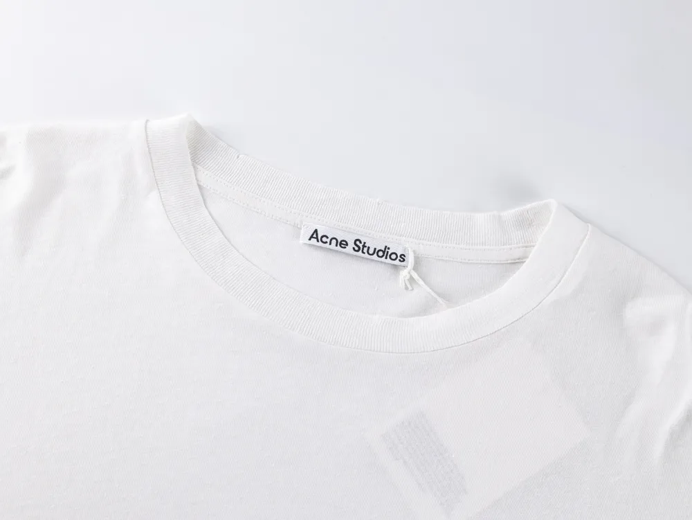 White cotton t-shirt, close-up of the neckline and label area.