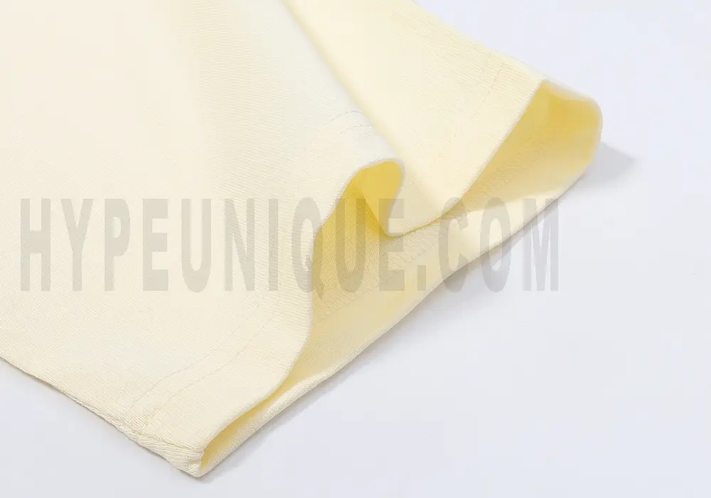 Precision cutting and sewing techniques on sleeves.