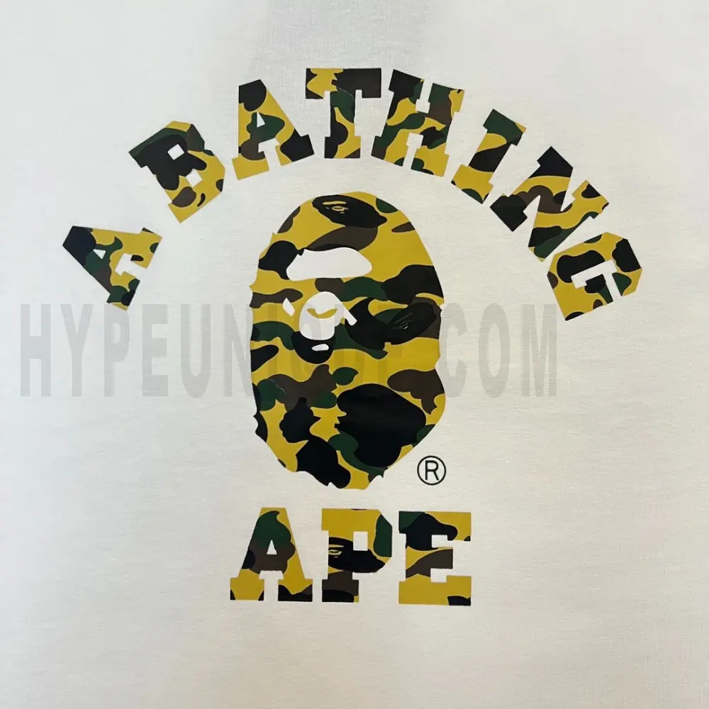 Detailed shot capturing the graphic print on the white tee's front panel.