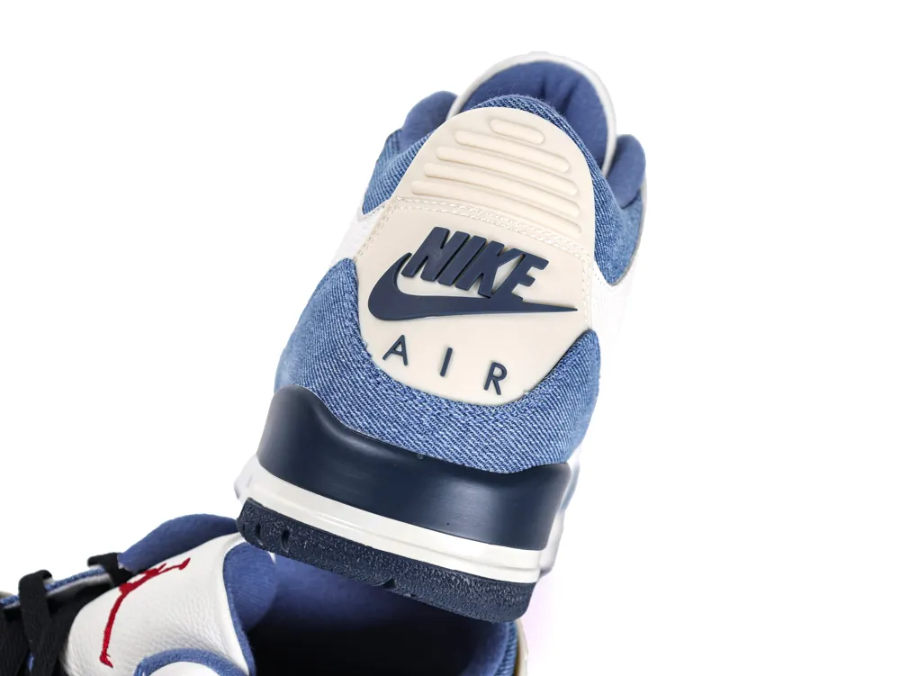 Rear angle highlighting the off-white heel counter, Nike Air logo, and the blue denim texture on the upper.
