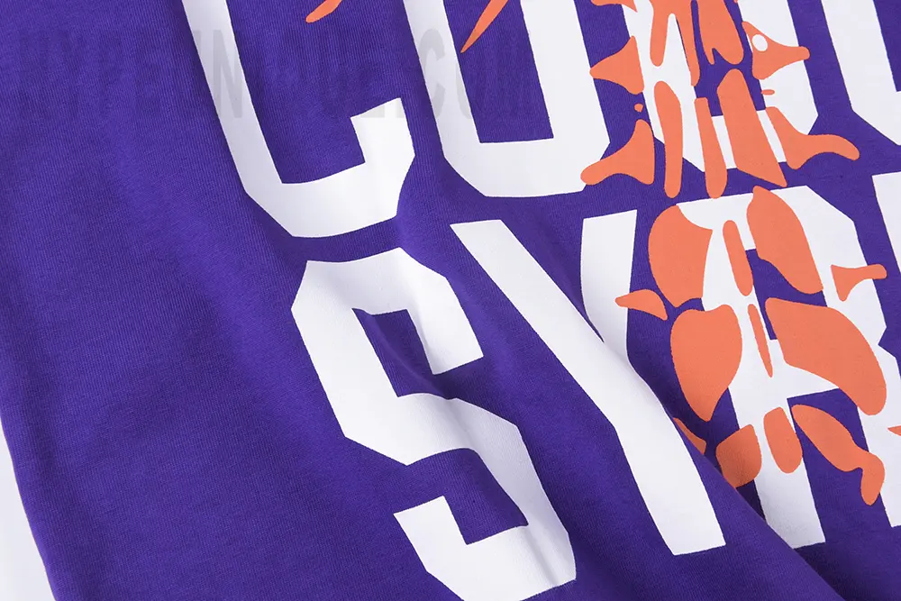 Close-up view of the white logo detail on the left side of the That’s A Awful Lot of Cough Syrup Skull Ribs T-shirt.
