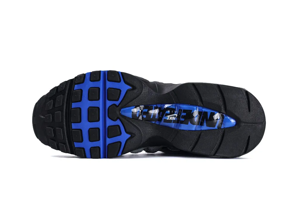 Black and blue rubber sneaker sole with detailed tread pattern and logo design.