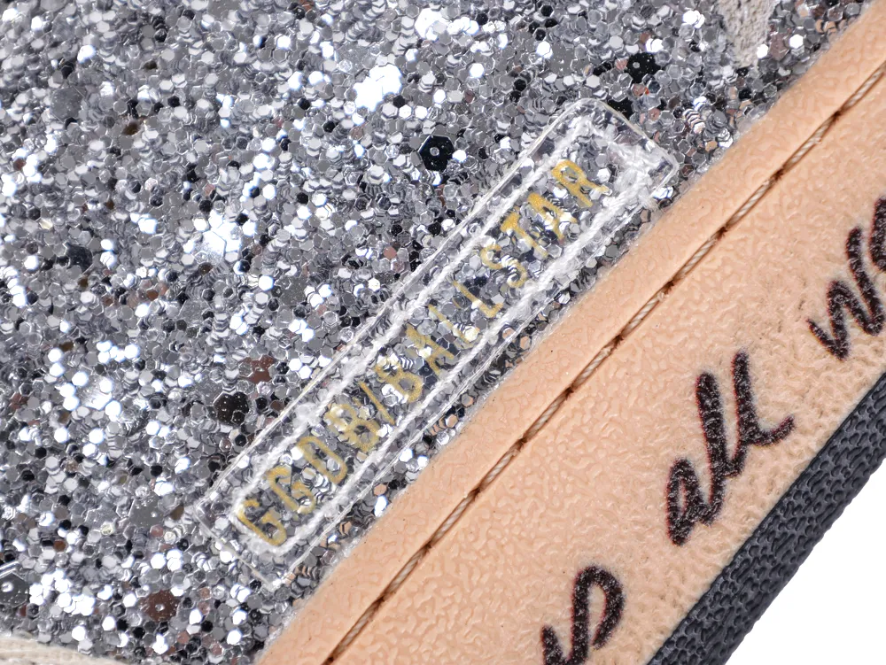 Close-up of silver glitter texture and GGDB/BALLSTAR branding on sneaker