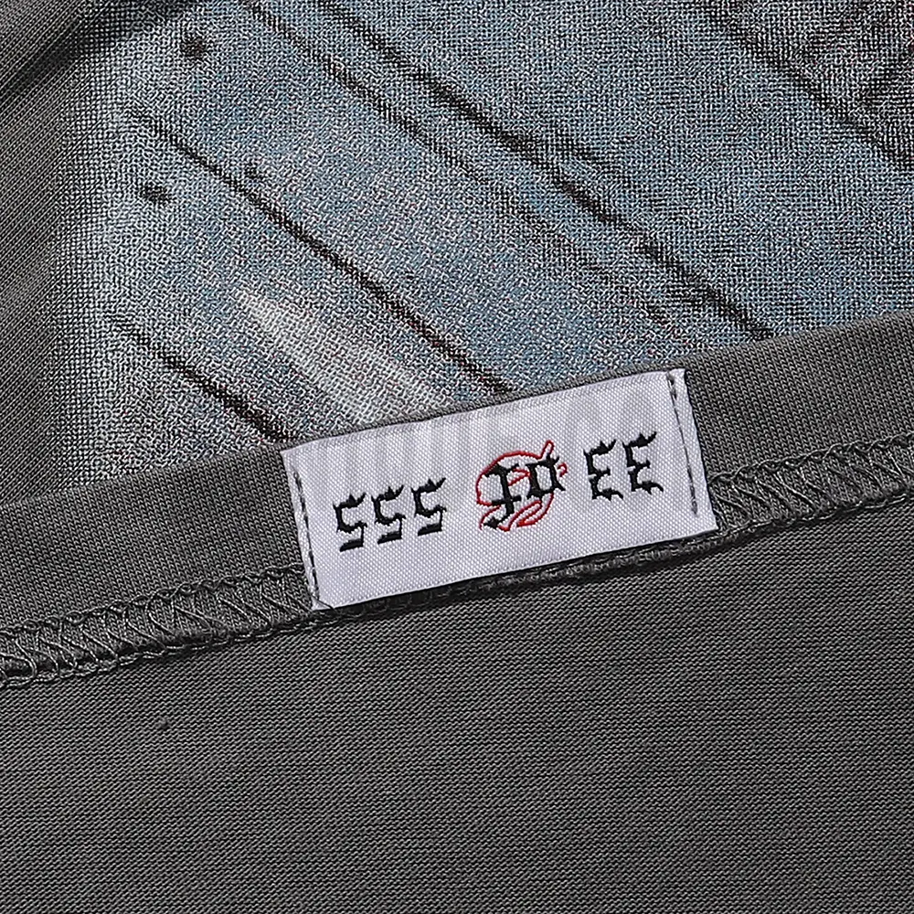 Clean hemline finish with a modern cut, highlighting the T-shirt's streetwear aesthetic.