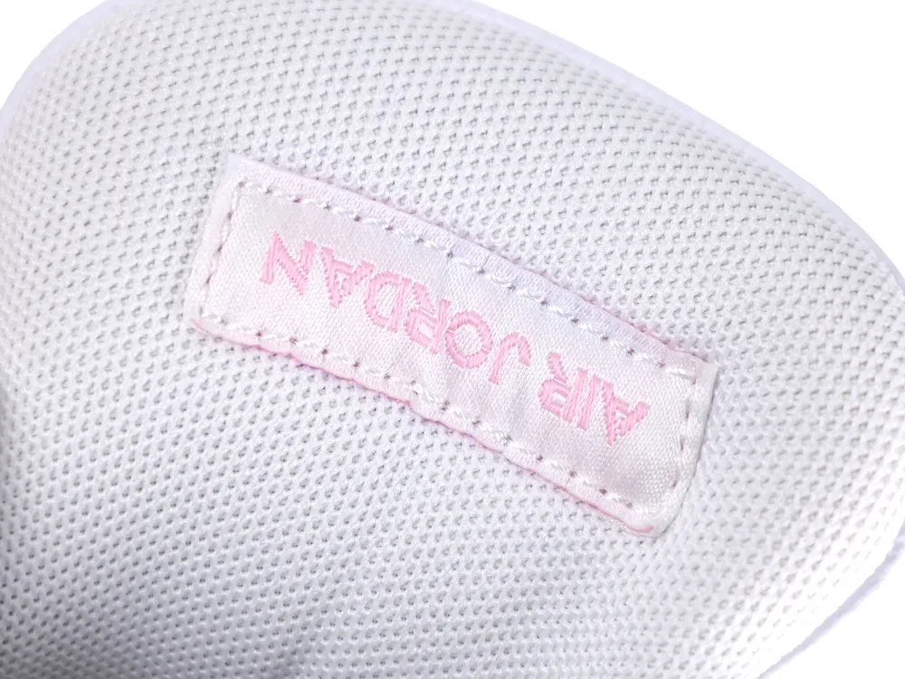 Close-up of the Jordan 4 tongue logo and laces