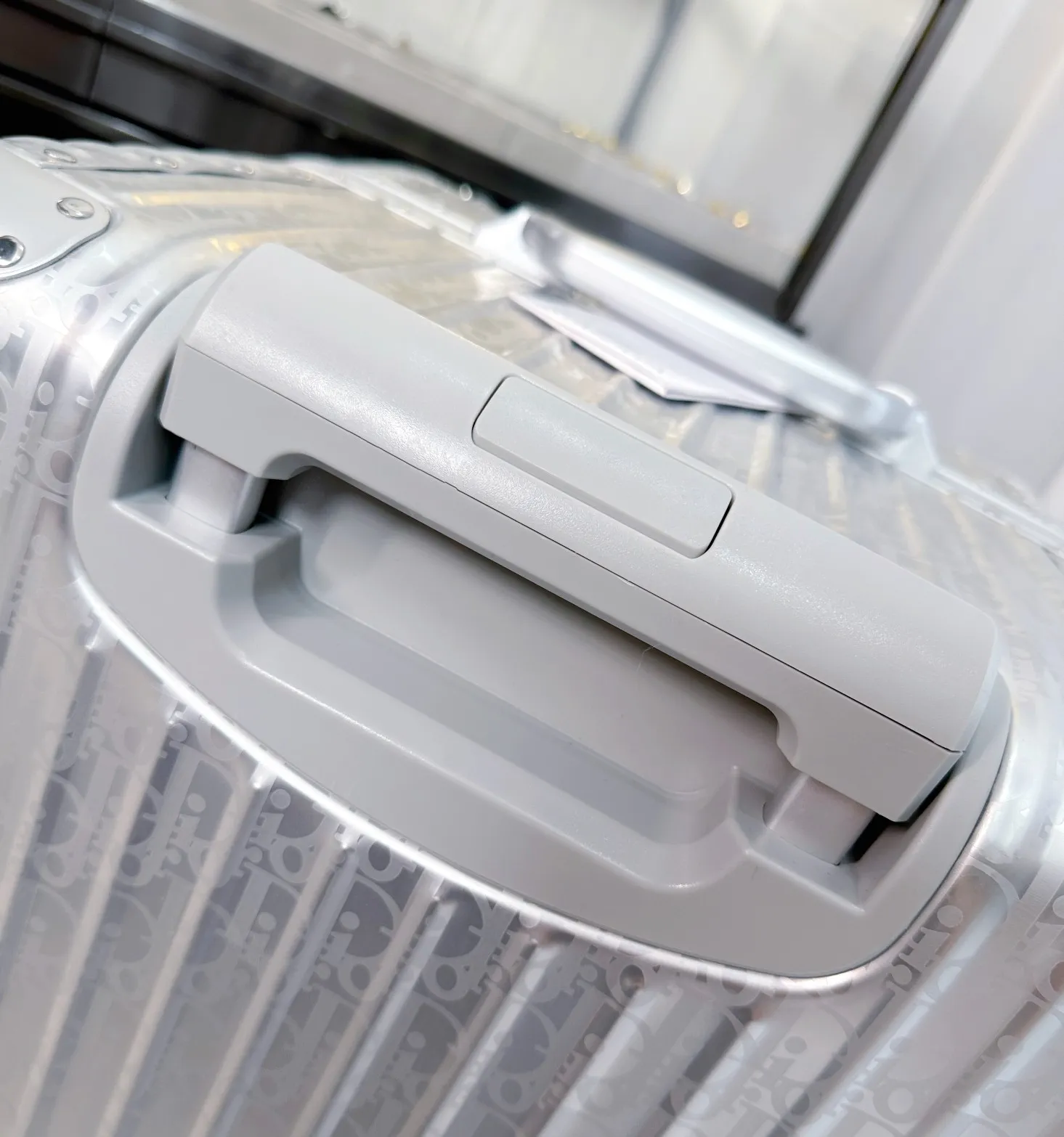 Close-up of silver suitcase carry handle