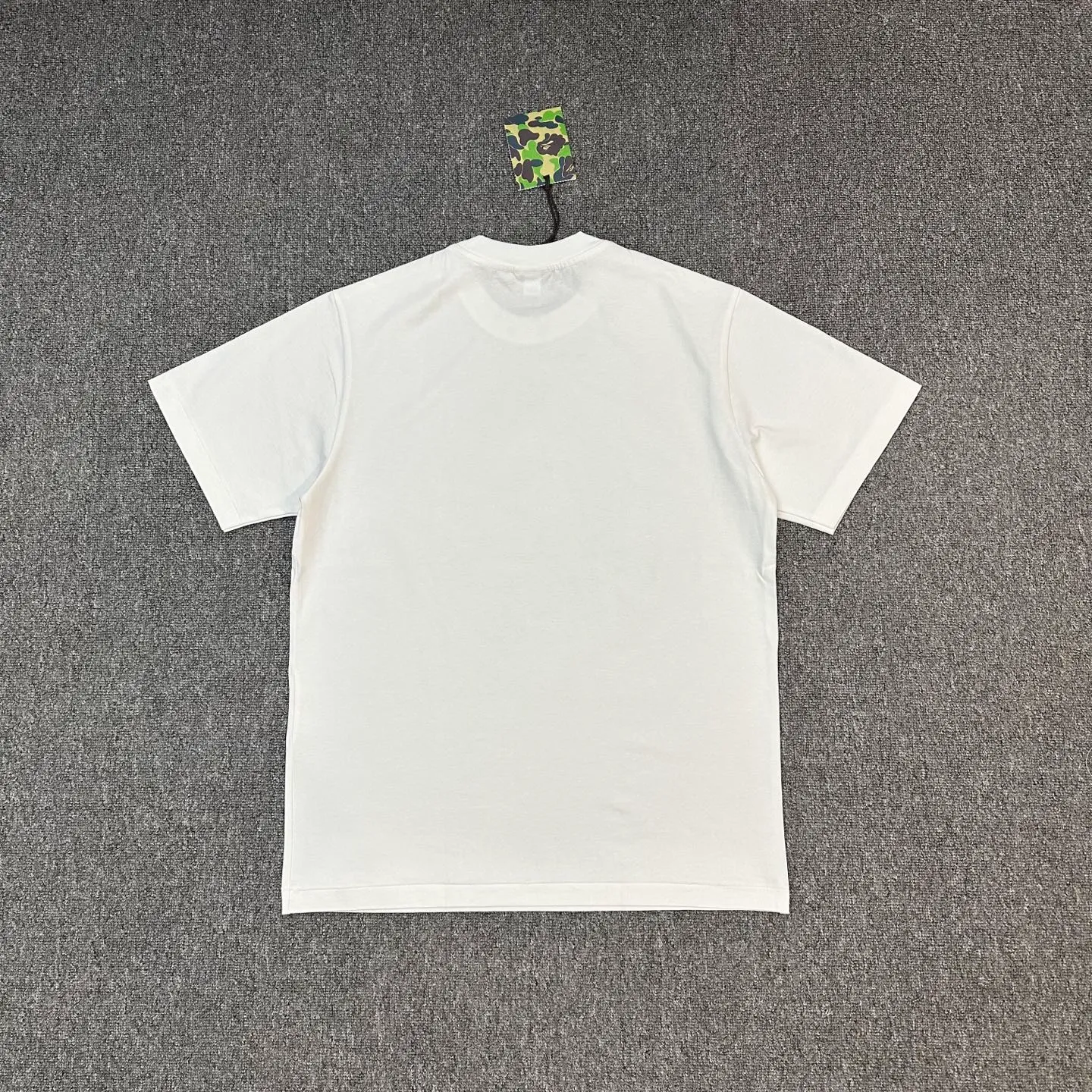 Back of BAPE SS25 1ST CAMO Mixed Color Ape Print T-Shirt Color White