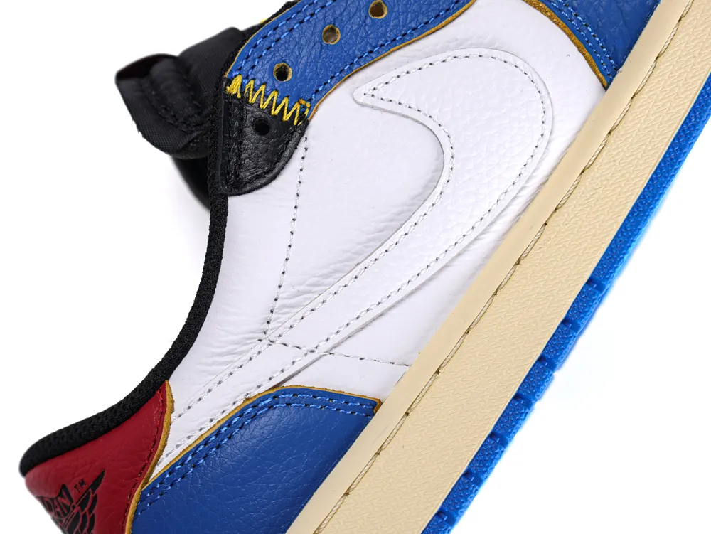 Close-up of a multicolored leather sneaker with red, blue, and white panels.