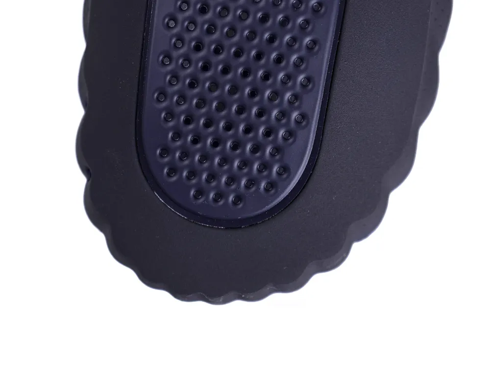 Overhead view of the rounded toe area featuring a textured navy blue finish and perforated details.