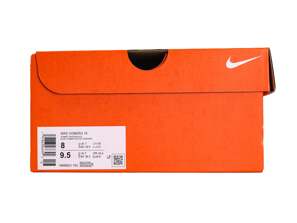 Orange cardboard shoe box with Nike logo, white label displaying product details.
