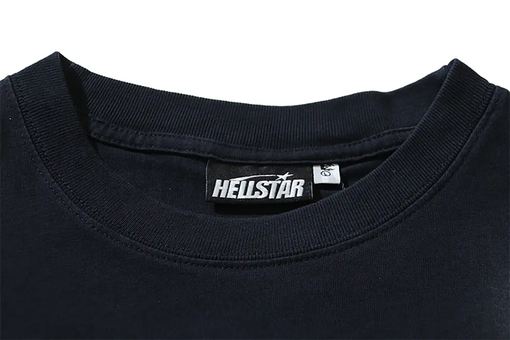 Close-up of the T-shirt's neckline tag, showcasing wash care instructions and brand details in a fashion design.