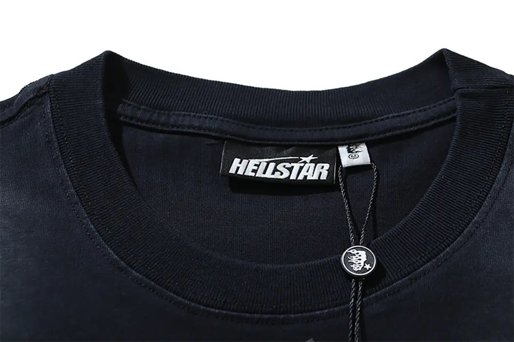Close-up of the T-shirt's neckline tag, showcasing wash care instructions and brand details in a fashion design.