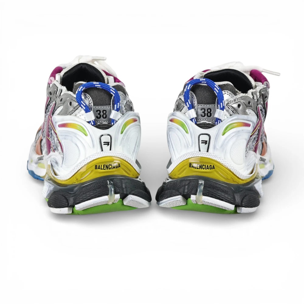 Multicolored sneakers with rubber soles and mesh uppers, featuring bold branding on heel.