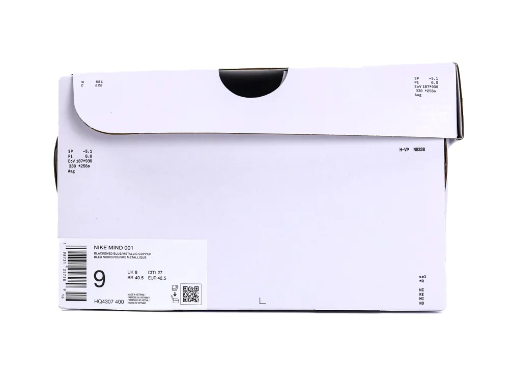 White Nike shoebox with a product label for "Nike Mind 001" in Blackened Blue/Metallic Copper.