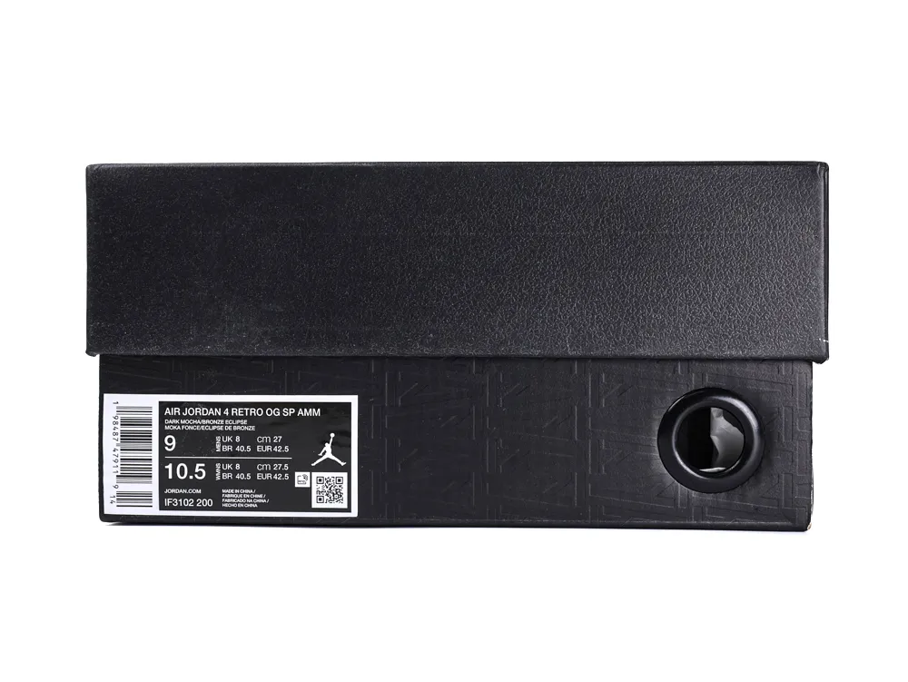 Black textured cardboard shoe box with a white label and black circular cutout.