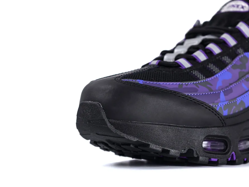 Black and purple sneaker with camouflage design and mesh detailing on the upper.