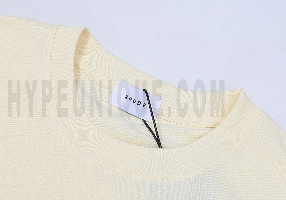 Clean hemline finish with a modern cut, highlighting the T-shirt's streetwear aesthetic.