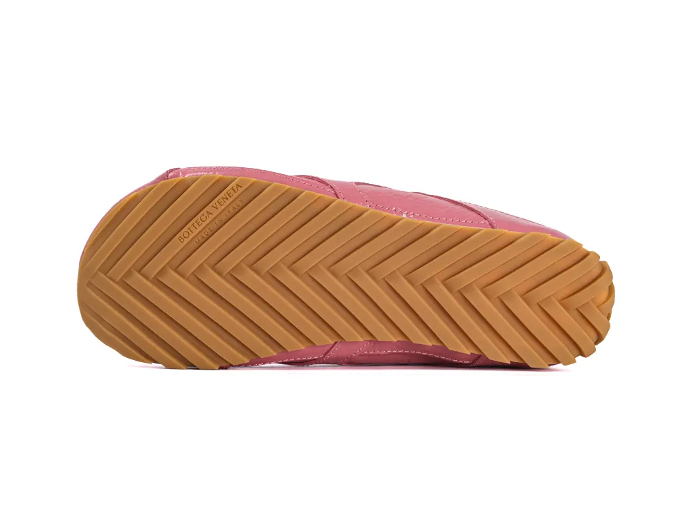 Gum rubber outsole of Bottega Veneta Orbit Flash sneakers featuring a chevron traction pattern.
