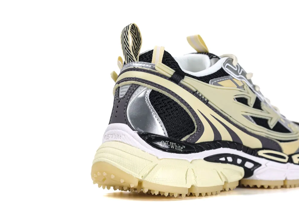 Beige and black sneaker with mesh and leather material, featuring detailed midsole design.