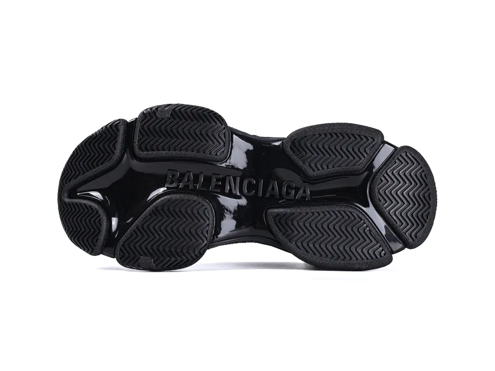 Black rubber sole with textured grip, featuring embossed brand name.
