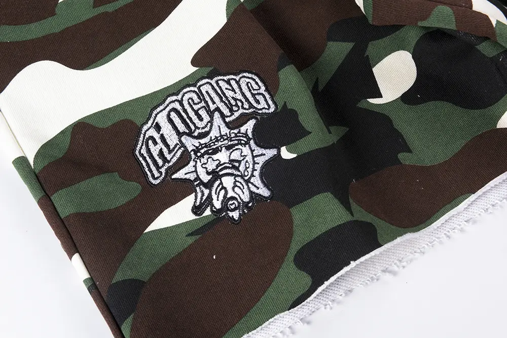 Brand logo on the right side of the pant leg