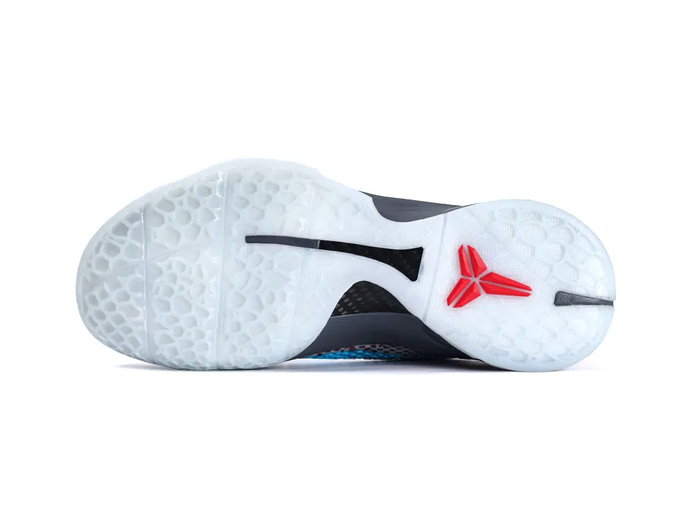 White, rubber sole of a shoe with red logo and textured grip pattern.