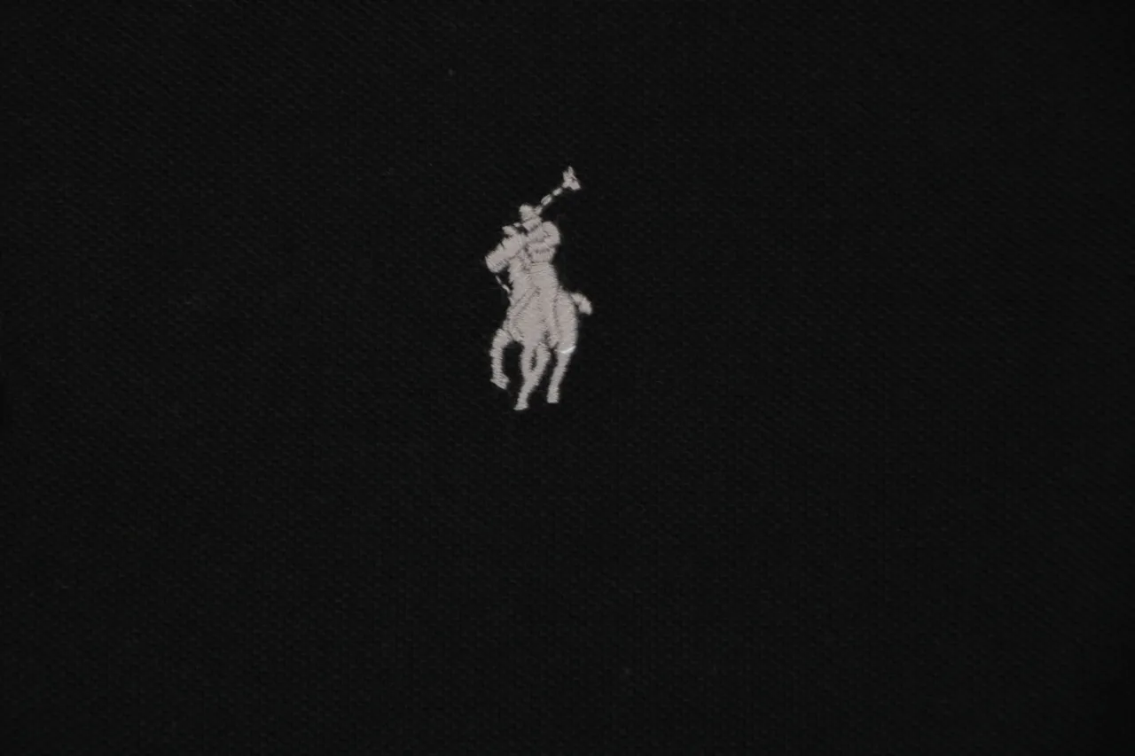 Black cotton fabric with white embroidered horse logo